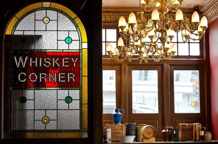 A glass window that says "Whiskey Corner"